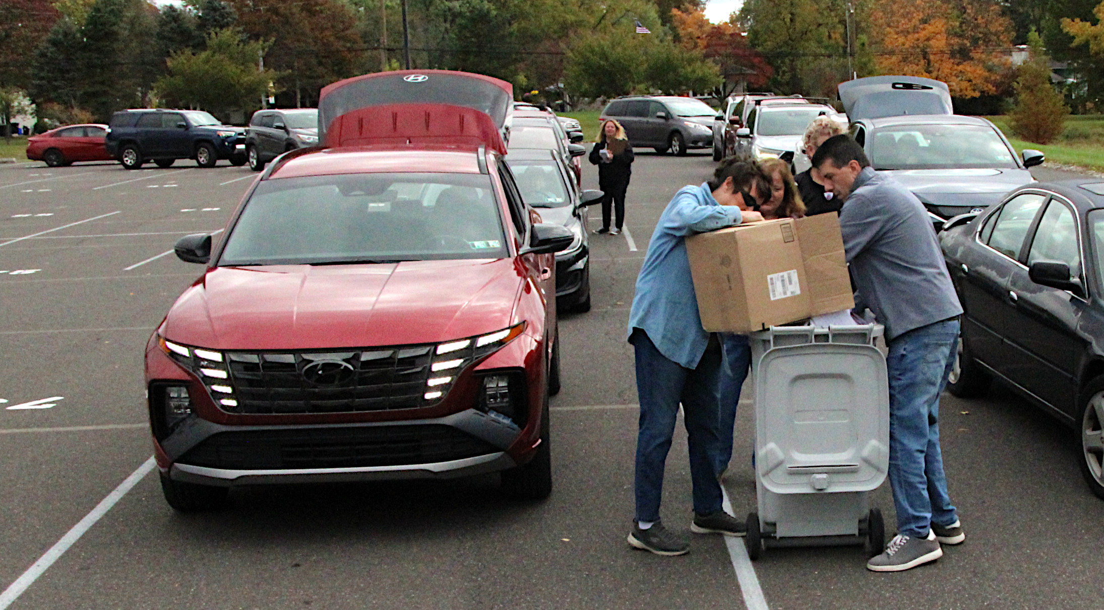 Lines of Cars Stretch Across Lot for Shredding Services