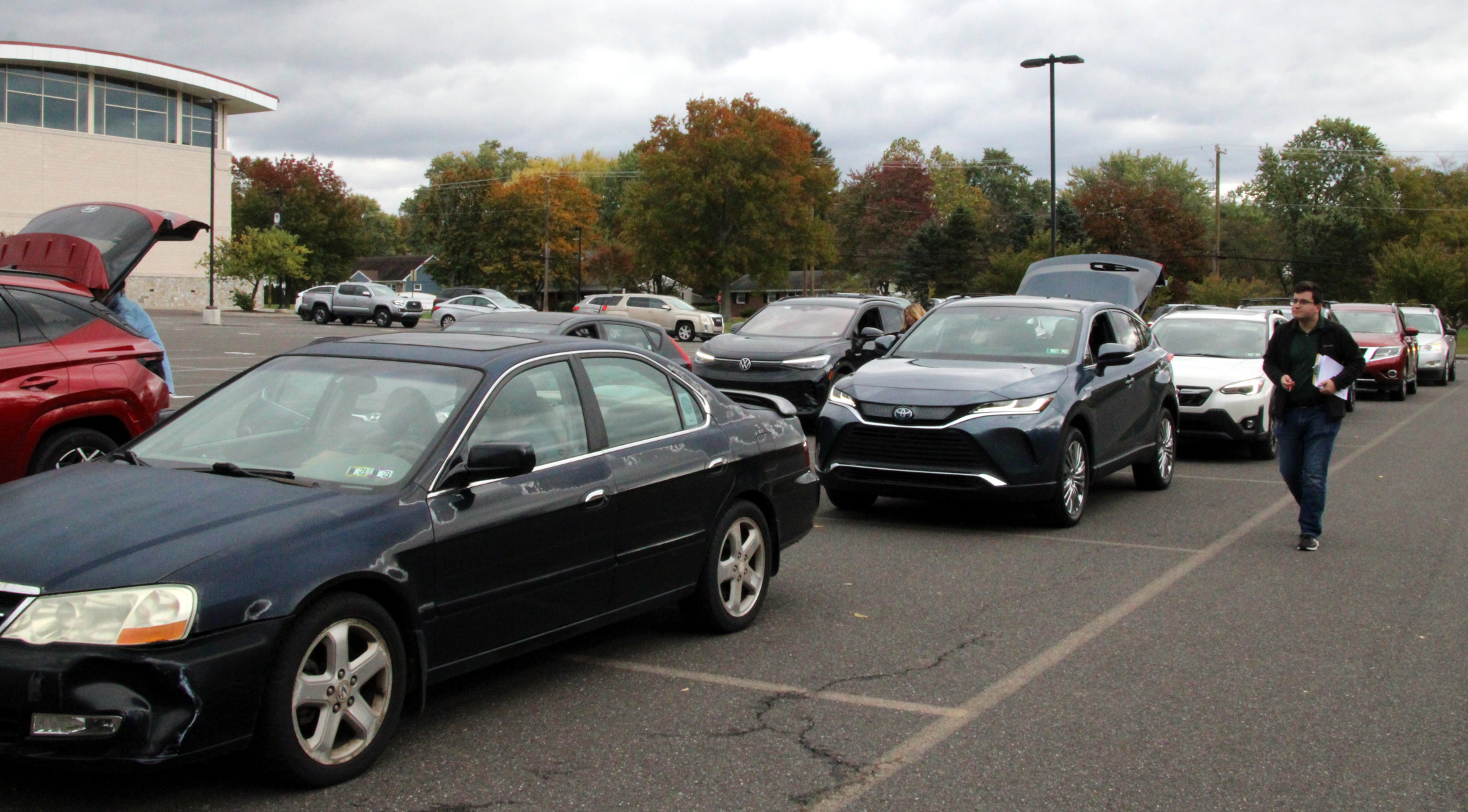 Lines of Cars Stretch Across Lot for Shredding Services